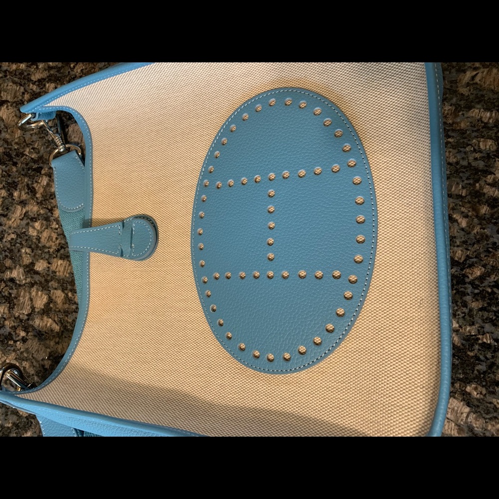 Cute blue and tan crossbody purse.